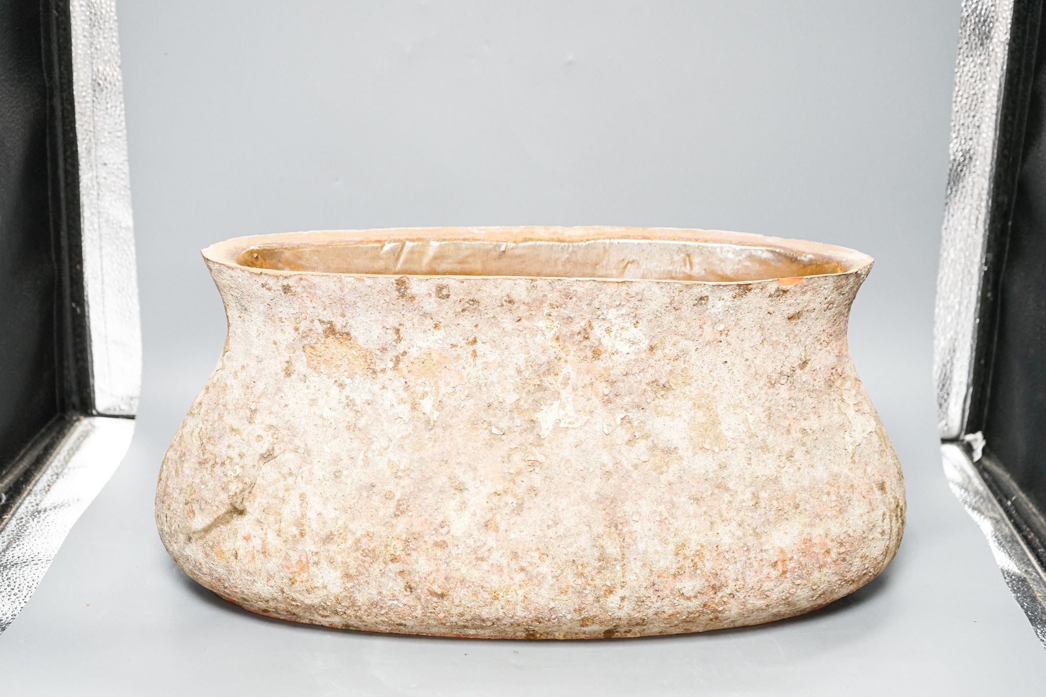 A large rustic terracotta vessel of boat form 45cm